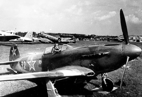 Soviet pilot with plane at Tempelhof Airport in Berlin May, 1945, Germany