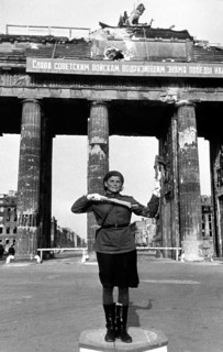 Soviet traffic police officer regulates traffic in front of the Brandenburg Gate, June 1945,