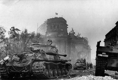 View of the Reichstag on May 1, 1945 with the Soviet flag on the roof. View from the Brandenburg