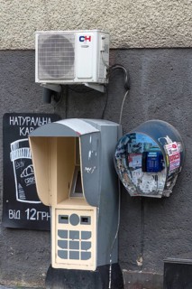 Public telephone on a house wall, Drochobych, Ukraine