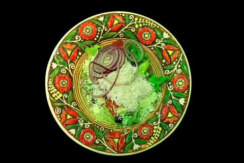 Mixed salad with sheep cheese on a colorful plate, Ukraine