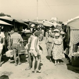 Historical photo summer 1961, market with tourists, Rimini, Italy