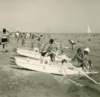 Historical photo summer 1961, tourists, beach, Rimini, Italy