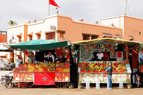 Stalls selling freshly squeezed fruit juices and smoothies on the Djemaa el Fna juggler square,
