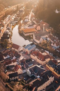 Historic city on a river, surrounded by trees and old buildings, test trip on the new Hermann-Hesse