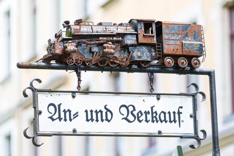 Advertising sign with a model of a steam locomotive for purchase and sale, Chemnitz, Saxony,