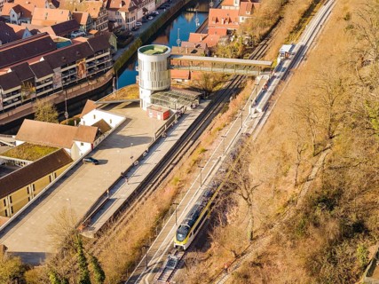 Train line with bridge near city center, embedded in fascinating architecture, test run on the new