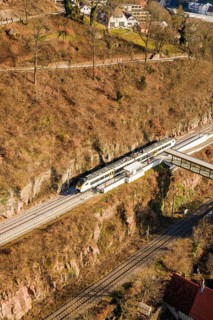 Aerial view of a railway scene in hilly surroundings, test run on the new Hermann-Hesse railway