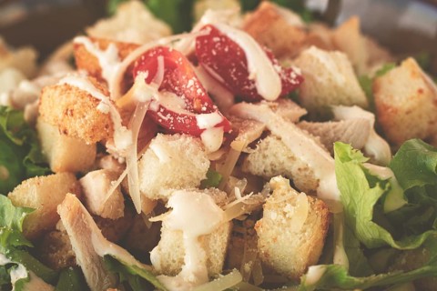 Classic Caesar salad, close-up, natural light, selective focus, horizontal