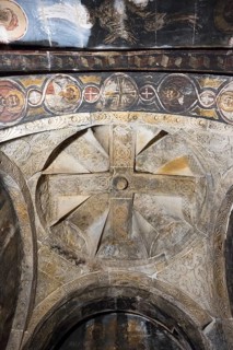 Cross-shaped frescoes on a richly decorated church ceiling in black and white tones, Nikorzminda