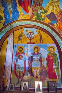 Orthodox icons and frescoes depicting religious figures and colors in a church, Nikorzminda