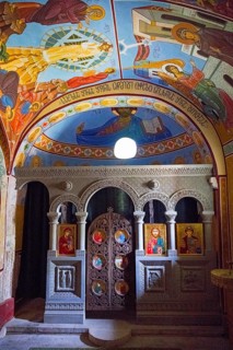 Colourful altar area of an Orthodox chapel with frescoes and icons, Nikorzminda Cathedral,