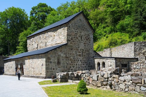 Historic stone church with trees in the background and a footpath, Chitakhevi Church of St. George,