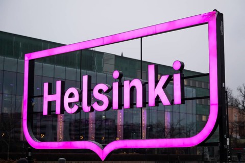 Large pink city logo of Helsinki near Oodi Central Library and Cultural Center, Helsinki, Finland