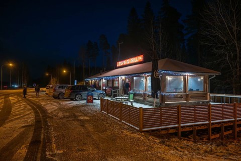 Illuminated rest stop, Stop'n Go Grilli or grill on the Finnish motorway in a wintry atmosphere,