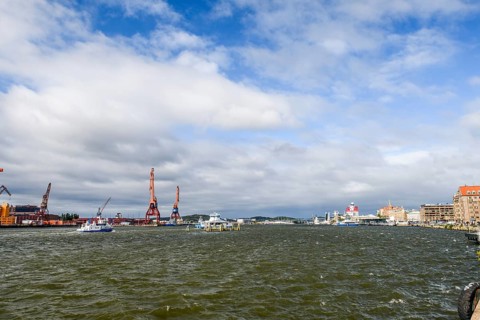 City and harbor landscape with cranes and cloudy sky, Gothenburg, Västra Götalands län, Sweden