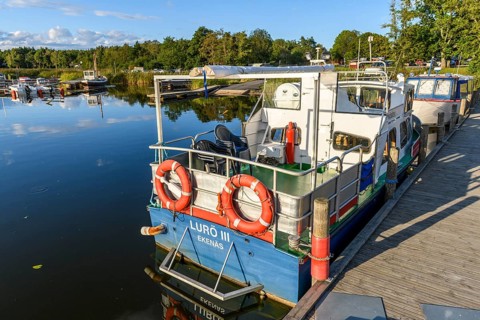 Small boat that connects Ekenäs in Lake Vänern with the Lurö Archipelago in a quiet harbor with