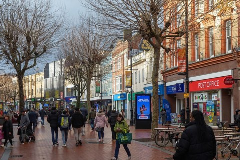 Shoppers in pedestrianised Broad Street on winter day, town centre of Reading, Berkshire, England,