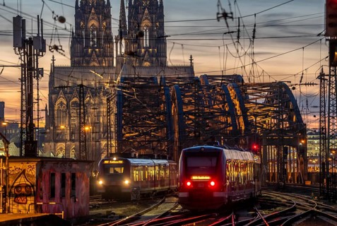 Rail track in front of Cologne Central Station, Hohenzollern Bridge across the Rhine, regional