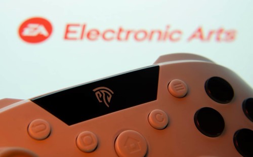 Dhaka, Bangladesh- 24 Mar 2025: A close-up of a gamepad with the Electronic Arts seen on screen in