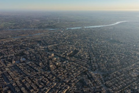In Deir ez-Zor, Eastern Syria on January 21, 2026, an aerial drone shot captures the city landscape