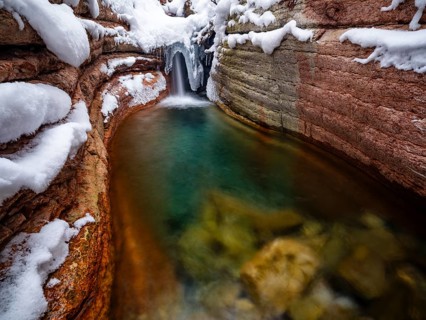 Taugl or Tauglbach flows through the snow-covered and icy red gorge, also Marmorklamm, Bad Vigaun,