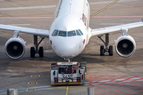 Eurowings Airbus is pushed from the gate onto the taxiway, ready to go, to Cologne/Bonn Airport,