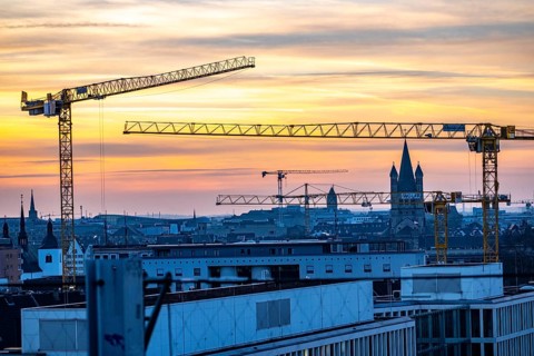 View of downtown Cologne, construction cranes from various construction sites, tower of Groß St.