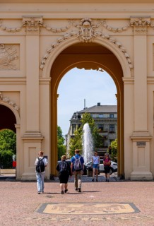 View through the Brandenburg Gate to the fountain on Luisenplatz, Potsdam, Brandenburg, Germany