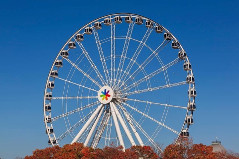 The Montreal Observation Ferris Wheel or La Grande Roue de Montreal amusement ride in autumn, Old