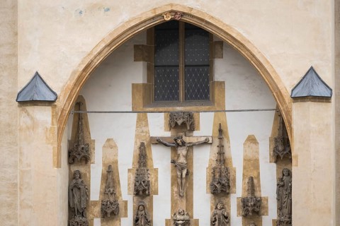 Christ sculpture and remains of the former monastery church of S. Johannes Baptistam above portal