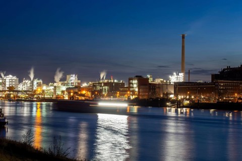 Evening shot of BASF in Ludwigshafen with the Rhine in the foreground