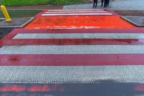 Zebra crossing marked in red and white, Krakow, Poland