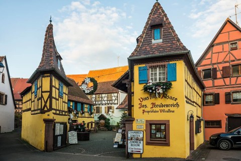 Christmassy decorated houses and alley with half-timbered houses, Christmas market, Eguisheim,
