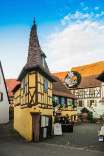 Christmassy decorated houses and alley with half-timbered houses, Christmas market, Eguisheim,