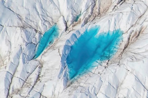 Aerial view of meltwater on the Greenland ice sheet, Arctic landscape, frozen wilderness, glaciers