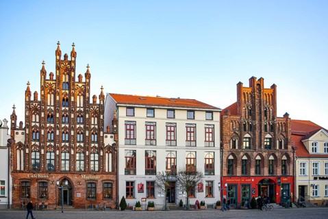 Historic brick Gothic buildings on the market square of the Hanseatic City of Greifswald,