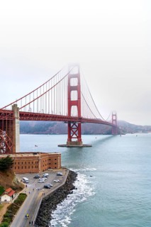 1937 Golden Gate Bridge in the mist, red Art Deco suspension bridge linking San Francisco to Marin