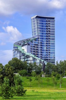 Sculpture First Swallows, Pirmosios kregzdes in front of the ARFA Tower, high-rise residential