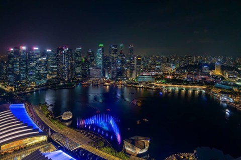 Aerial view from Marina Bay Sands SkyPark Observation Deck over the illuminated skyline of the city