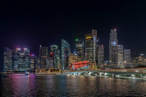 Skyline of the Central Business District, CBD with illuminated skyscrapers and Jubilee Bridge in