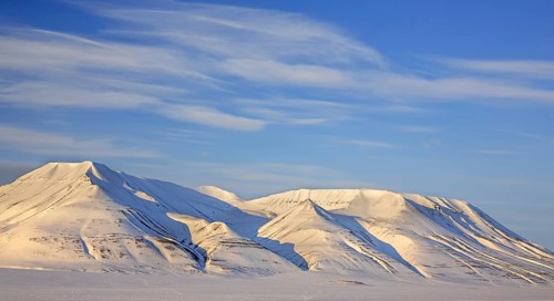 Snow covered mountain Operafjellet, Opera Mountain on the north side of Adventdalen near