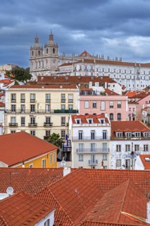 View over rooftops, flats and the Church and Monastery of São Vicente de Fora in Alfama, oldest