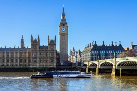 Uber Boat river bus by Thames Clippers on River Thames, Westminster Bridge, Elizabeth Tower, Big