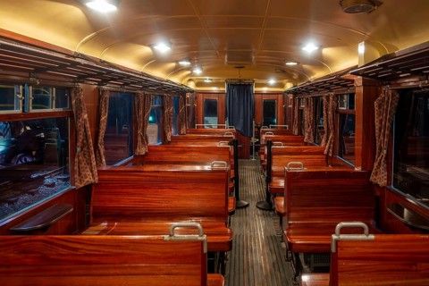 Interior of 1939 railcar, motor car Type 551 with wooden benches at Train World, railway museum in