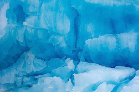 Blue ice wall of Monacobreen, glacier in Haakon VII Land which debouches into Liefdefjorden,