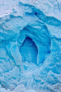 Blue ice wall of Monacobreen, glacier in Haakon VII Land which debouches into Liefdefjorden,