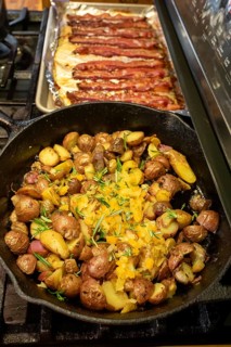 Denver, Colorado - Potatoes and bacon cookingon the stove for breakfast