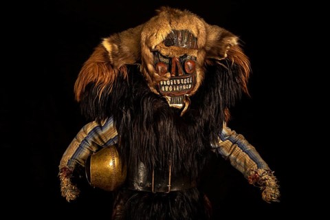 Portrait of traditional hand-carved wooden mask from the Loetschental Carnival, representing