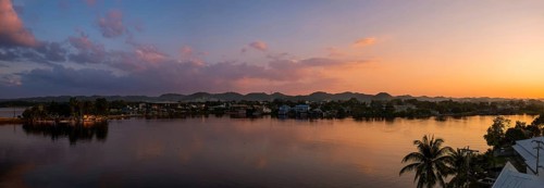 Scenic sunsets and colourful colonial architecture of historic center of Flores, Guatemala. View of